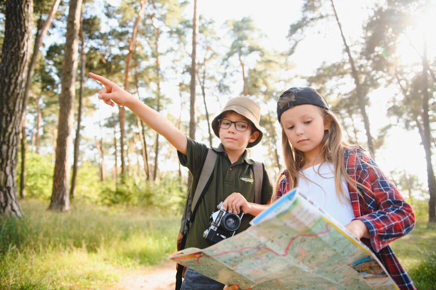 Boy and girl go hiking with backpacks on forest ro 2023 12 07 05 00 31 utc